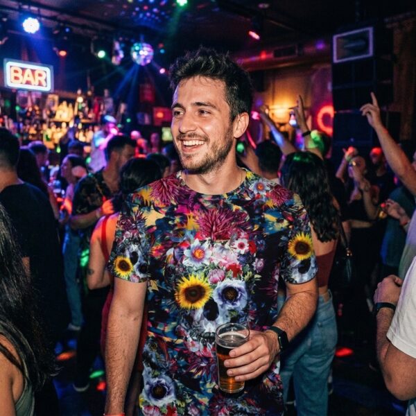 Man wearing Floral Skulls Pattern t-shirt at a club