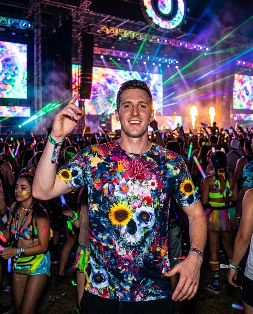 Friends at a festival, one wearing a floral skull all-over-print t-shirt